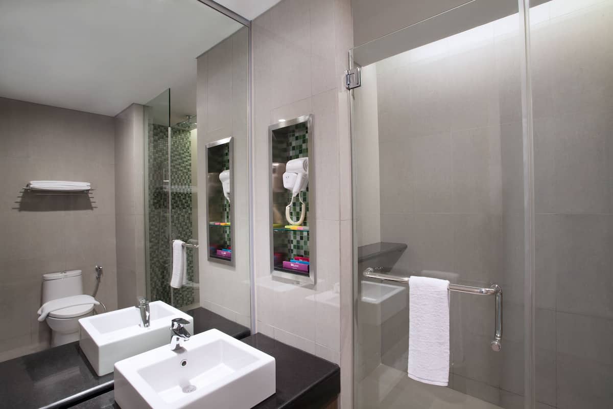 Shower, eco-friendly toiletries, hair dryer, slippers