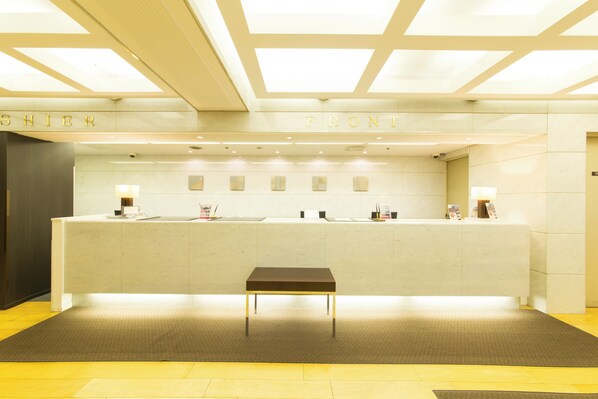 A reception area with a reception desk, a bench, and a wall with the words "FRONT" and "SHIER". - Hotel IL GRANDE Umeda (Osaka)