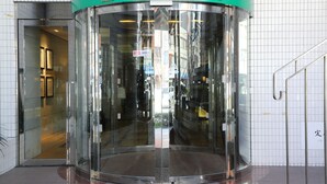 A revolving door at the entrance of Hotel Il Grande.