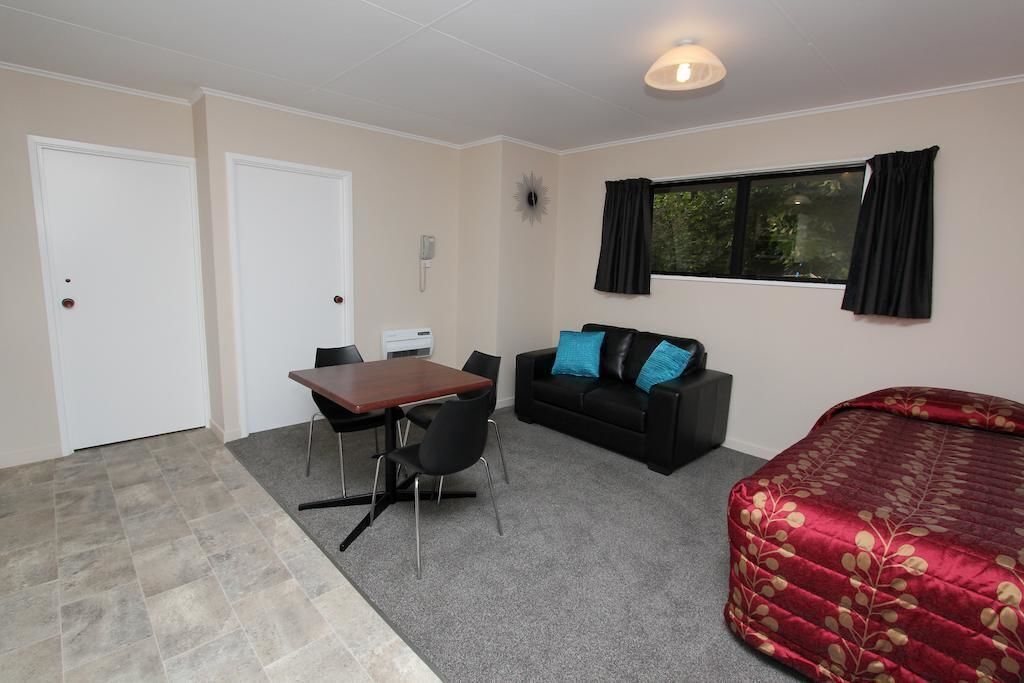 Desk, laptop workspace, iron/ironing board, free cribs/infant beds