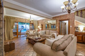 Double Room (Small 1) | Living area | TV - Kassaboera Lodge (Hartbeespoort)