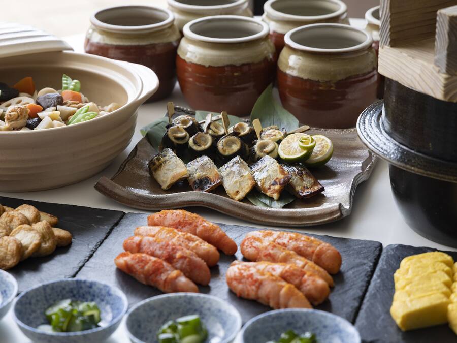 A variety of food items including seafood, vegetables, and condiments arranged on a table.