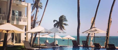 Outdoor pool, open 6:30 AM to 11 PM, pool umbrellas, pool loungers