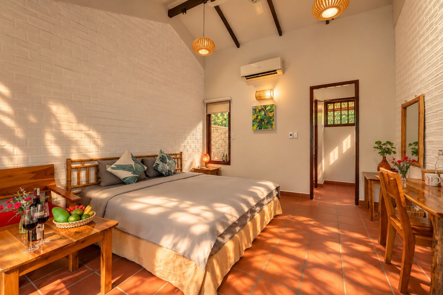 A bedroom with a bed, bedside table, and a window with a view.