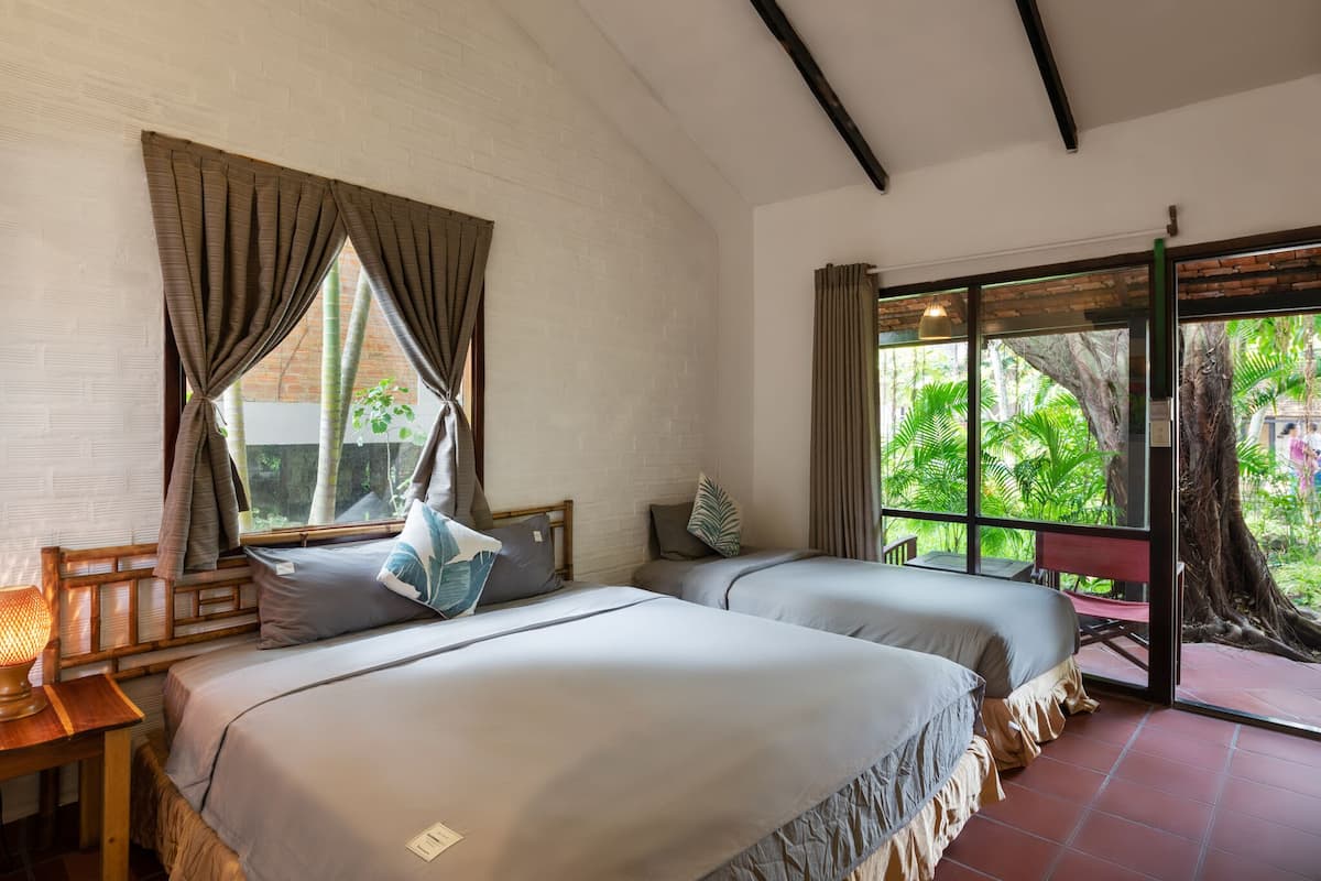 Phòng 3 Deluxe | Minibar, két bảo mật tại phòng, bàn 