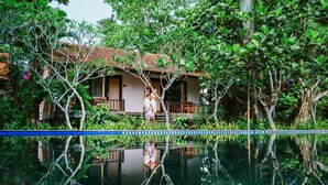 A house with a pool surrounded by lush greenery. - An Nhien Retreat Phu Quoc (Phu Quoc)