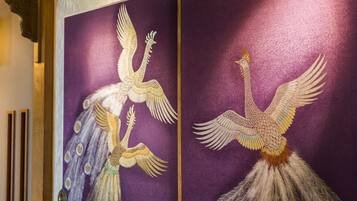 Two ornately decorated panels with peacock designs.