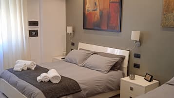 1 habitación, cubrecamas y caja de seguridad en la habitación