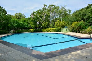 Outdoor pool, a waterfall pool, open open 24 hours a day, pool umbrellas