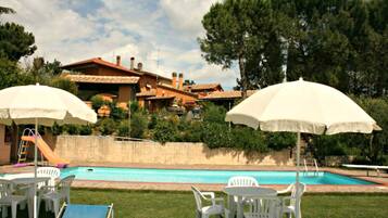 Outdoor pool, pool umbrellas, pool loungers