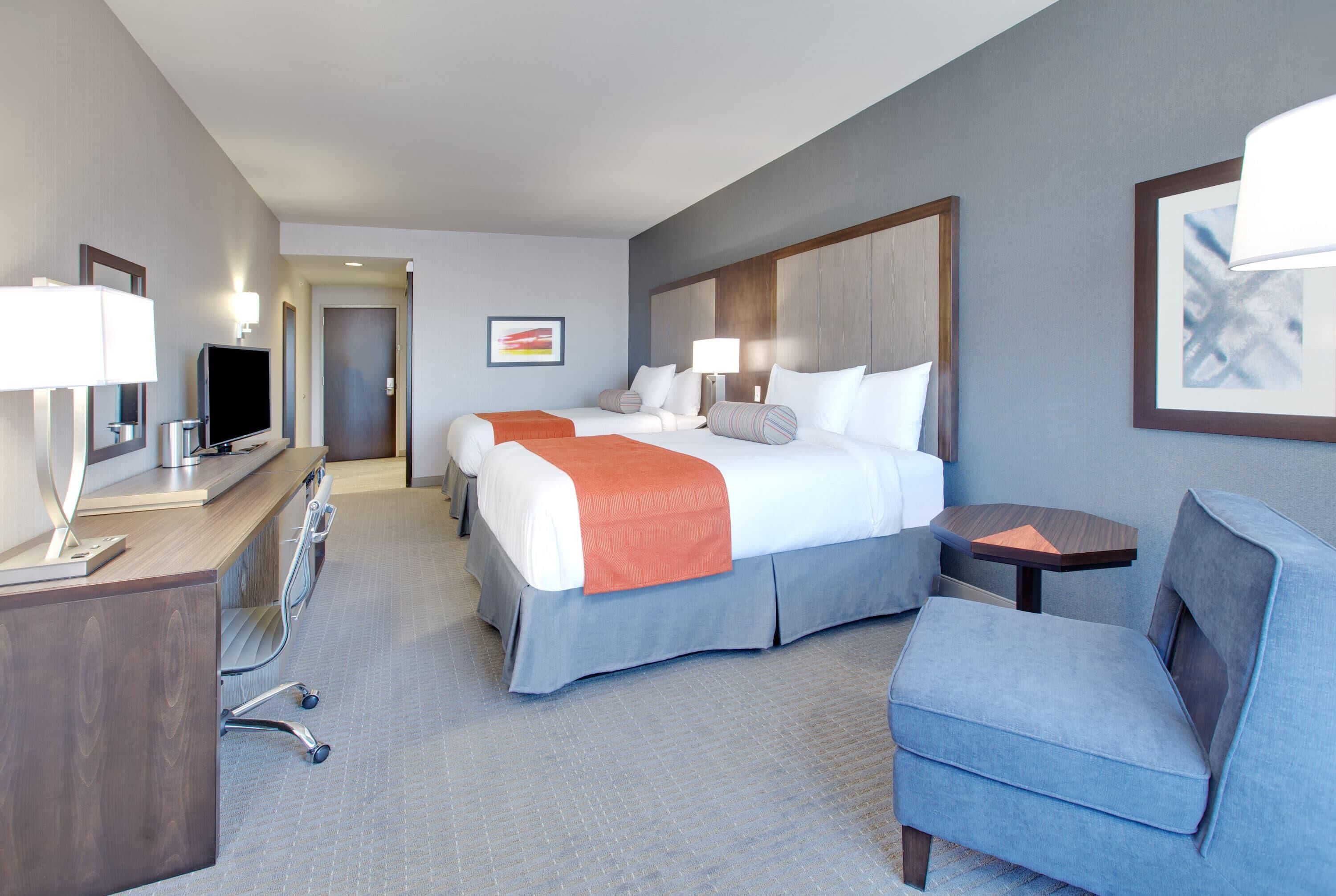 Deluxe Room, 2 Queen Beds, Non Smoking | In-room safe, desk, blackout drapes, soundproofing