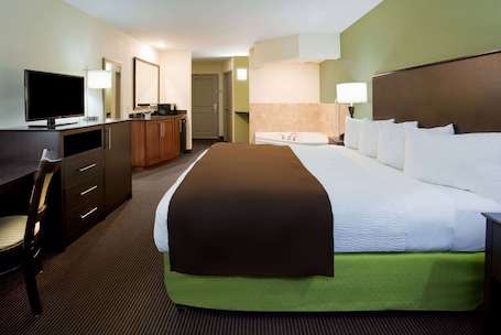 Studio Suite, 1 King Bed, Non Smoking | Desk, laptop workspace, blackout curtains, iron/ironing board. AmericInn by Wyndham Sibley