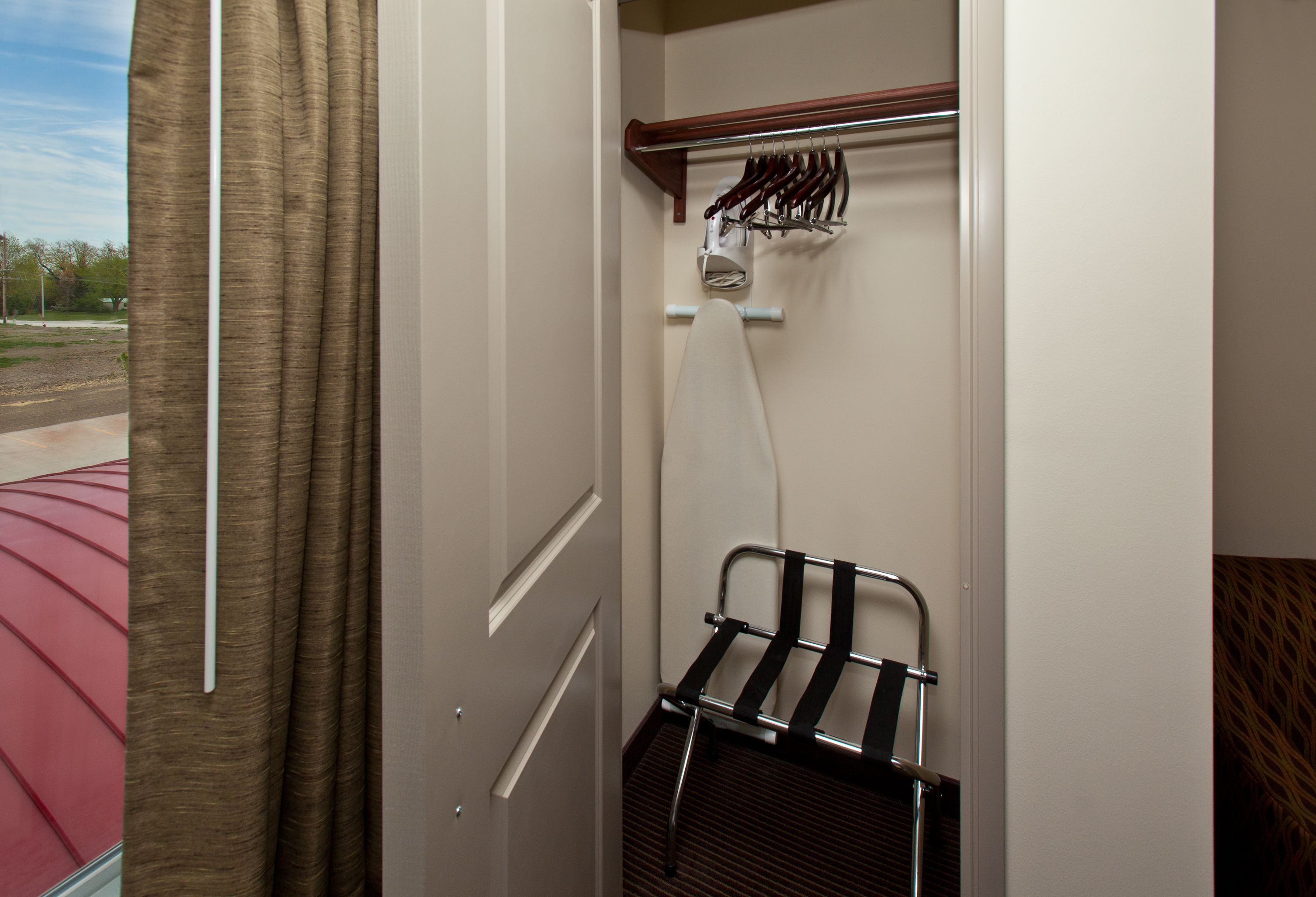 desk, laptop workspace, blackout curtains, iron/ironing board