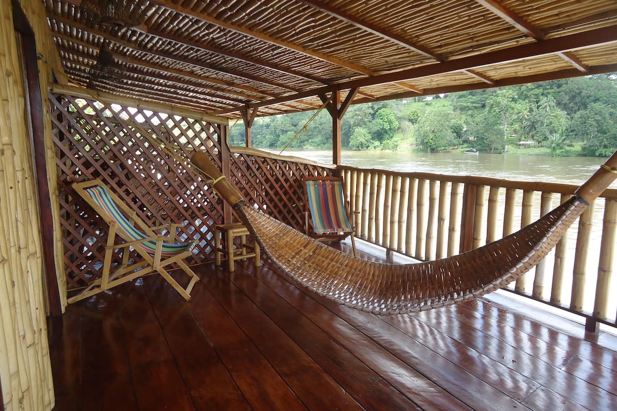Panorama suite, 2 queensize bedden, uitzicht op rivier, op het water | Veranda