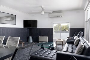 Four Bedroom Apartment | Living area | 50-inch LED TV with digital channels, TV