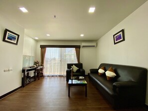 2 Bedrooms Suite | Living area | 32-inch LCD TV with satellite channels, TV, DVD player