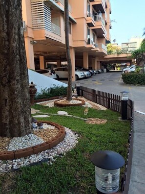Guests can park their vehicles in the secure parking area with easy access to the building.