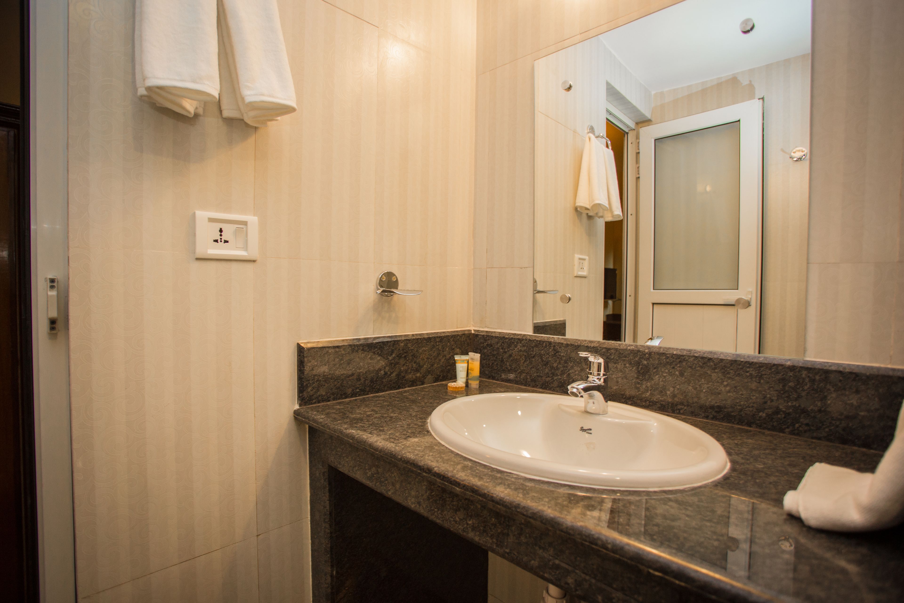 deluxe room | bathroom | shower, free toiletries, slippers, towels