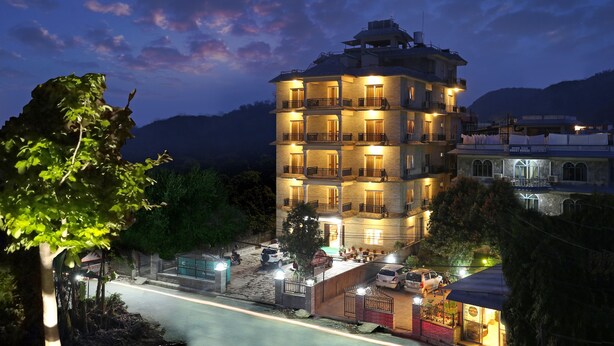 A multi-story hotel with balconies and a well-lit entrance. - Pokhara Choice Inn (Pokhara)