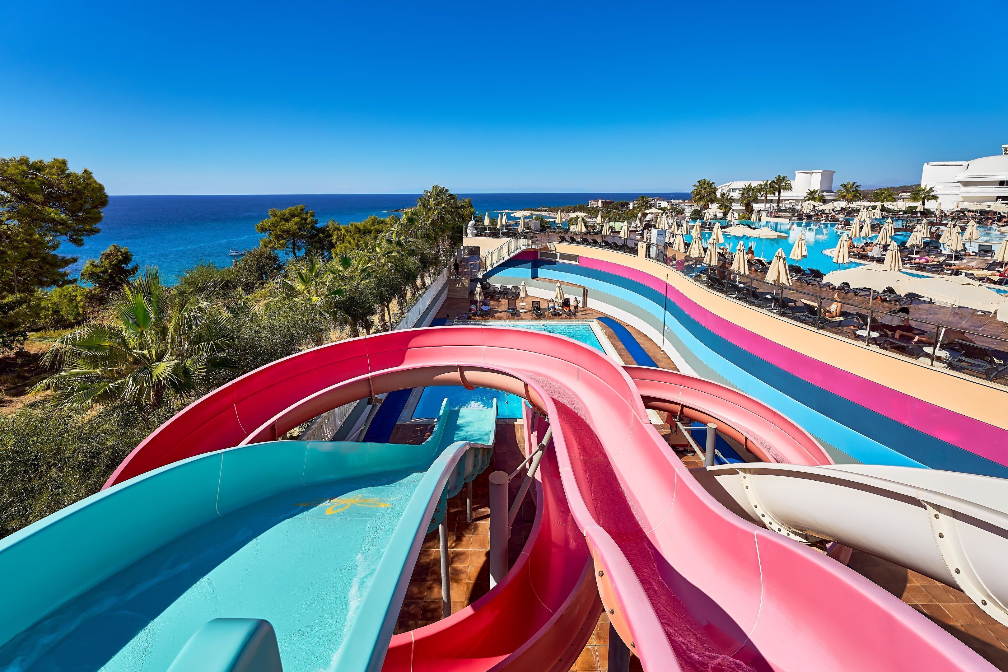 A water park with multiple slides and a pool area.