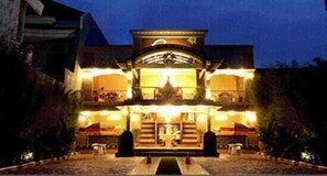 A two-story building with a central entrance, large windows, and a symmetrical facade. - Patria Palace Hotel (Blitar)