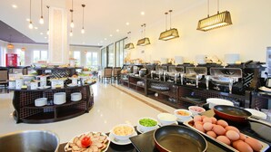 A buffet area with various food stations, including a selection of meats, cheeses, and eggs. - Hoian Sincerity Hotel & Spa (Da Nang)