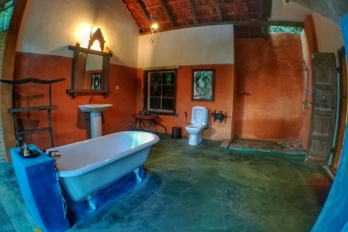 A bathroom with a bathtub, sink, and toilet.