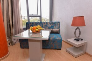 Suite Junior | Living area | 75-inch flat-screen TV with cable channels, TV - Le 135 appart hotel (Casablanca)