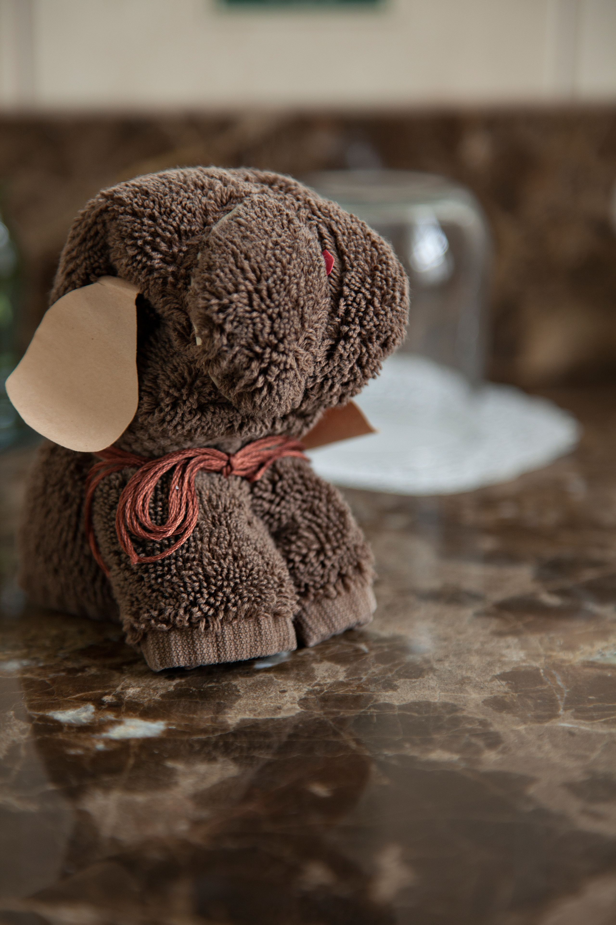 A plush toy on a marble surface.