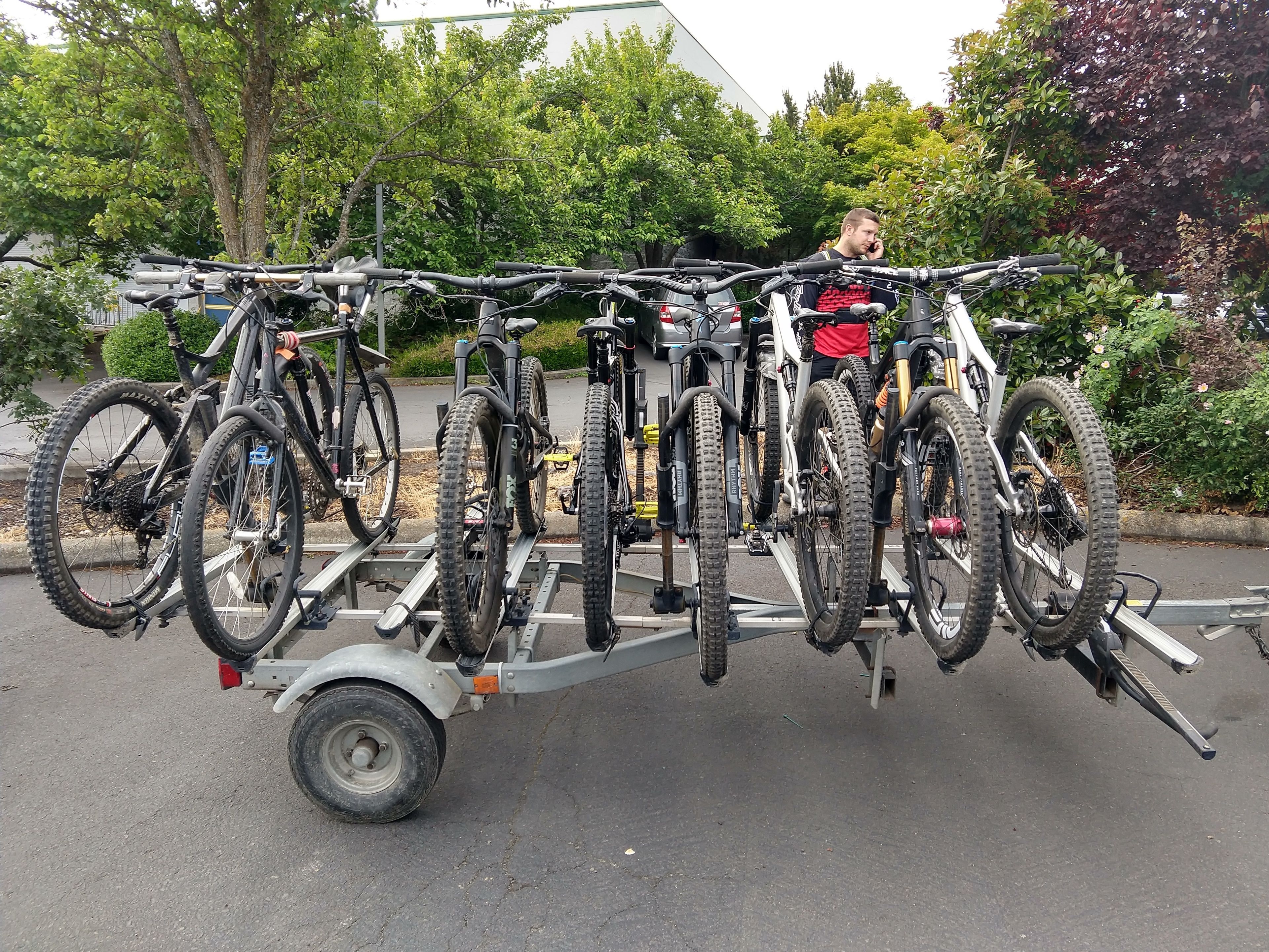 A bicycle rack with multiple bikes parked on it.