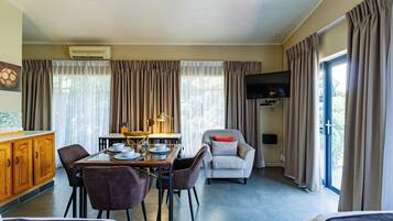 Standard Triple Room | Living area | 40-inch LED TV with satellite channels, TV