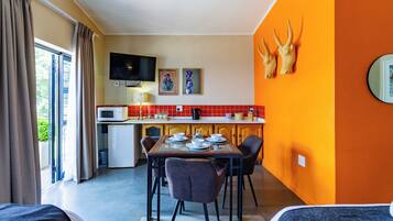 Standard Triple Room | Living area | 40-inch LED TV with satellite channels, TV