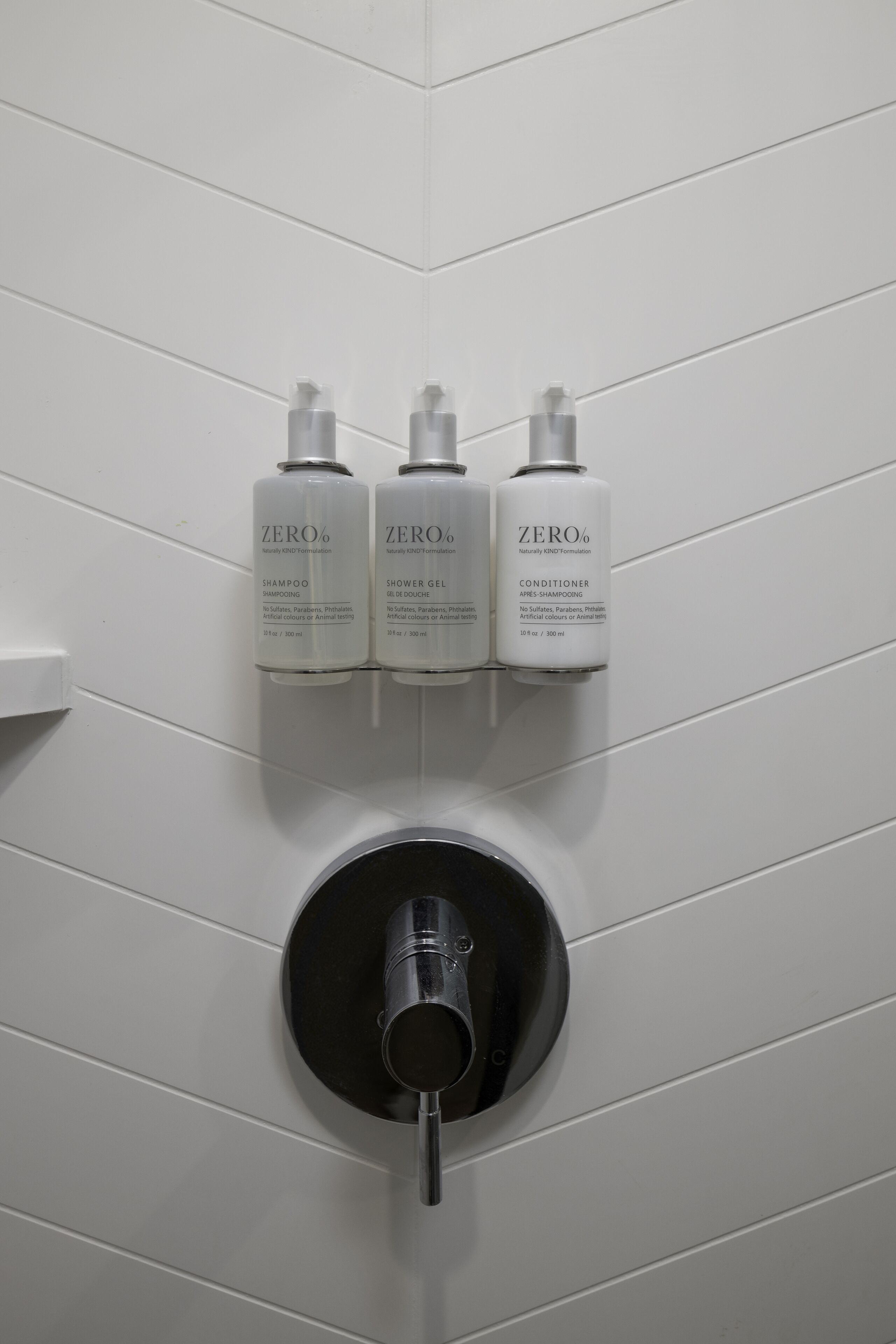 designer toiletries, hair dryer, bathrobes, towels