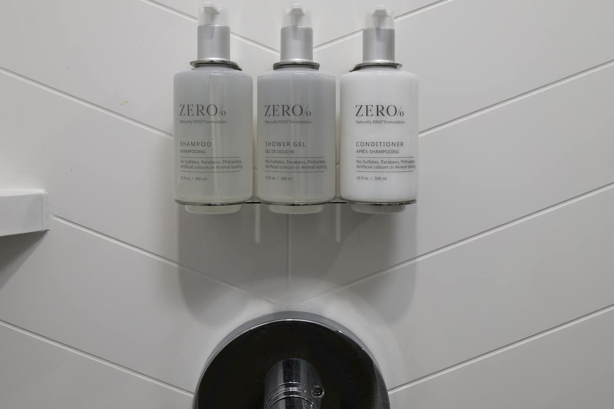 designer toiletries, hair dryer, bathrobes, towels