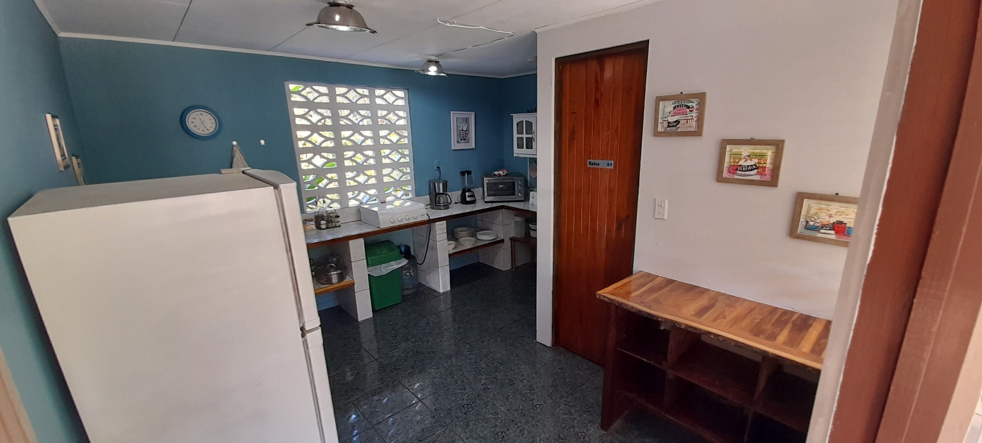 full-sized fridge, microwave, stovetop, toaster