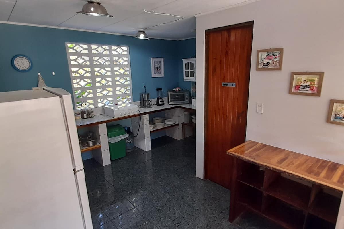 full-sized fridge, microwave, stovetop, toaster