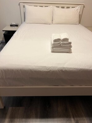 Individually furnished, desk, laptop workspace, iron/ironing board