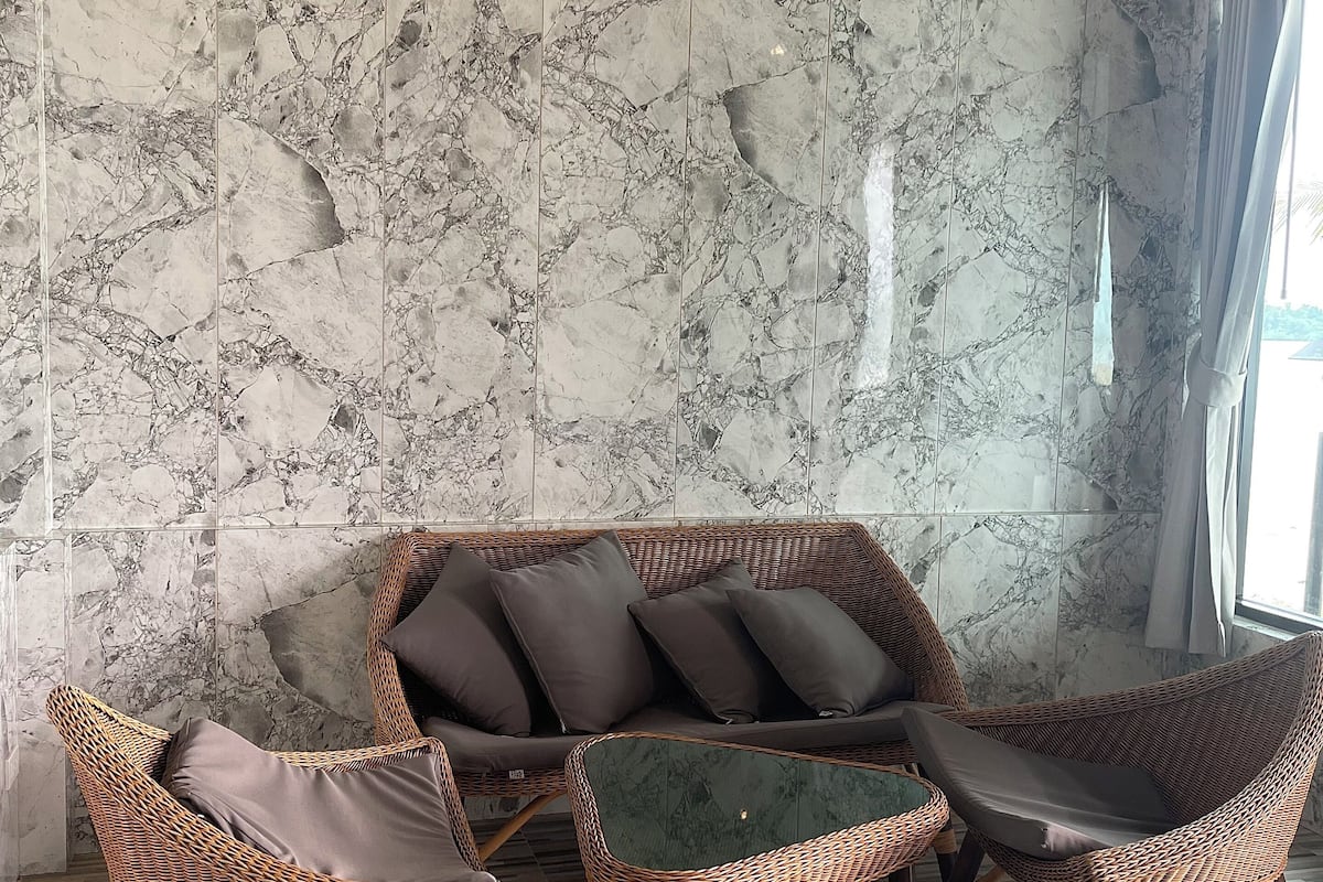 air-con beach front (4 persons) | living area | flat-screen tv