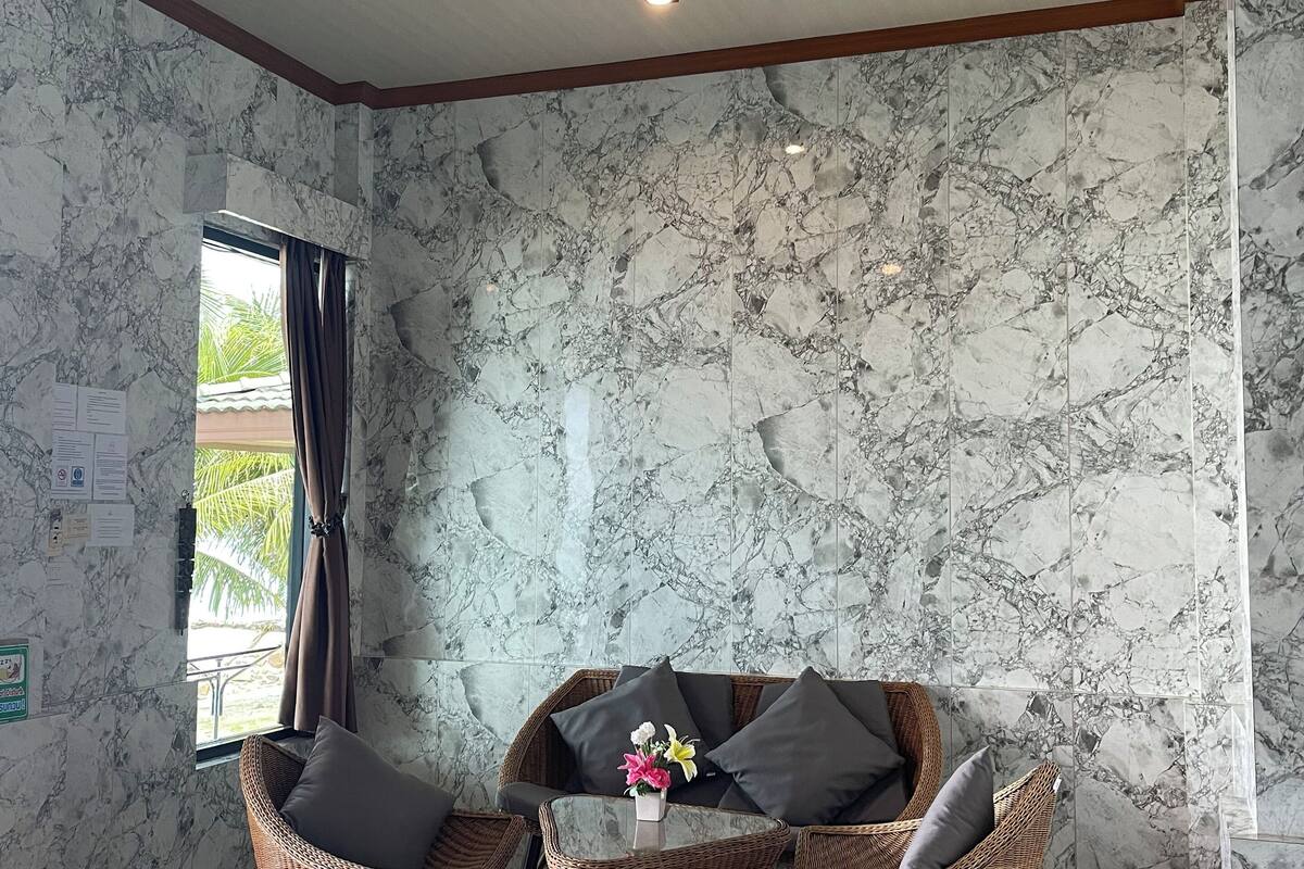 air-con beach front (4 persons) | living area | flat-screen tv