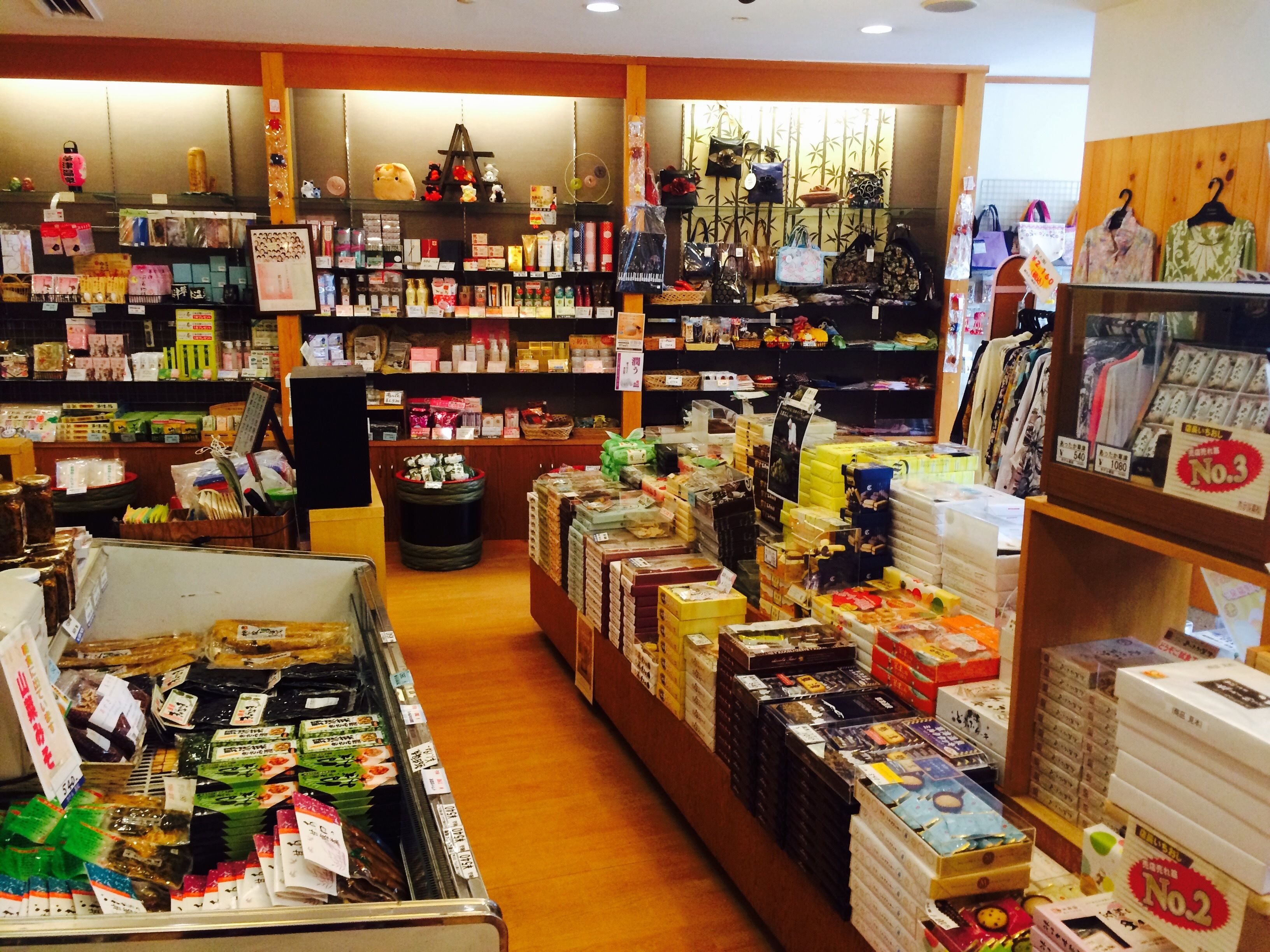 A store with shelves stocked with various products, including snacks and packaged goods.