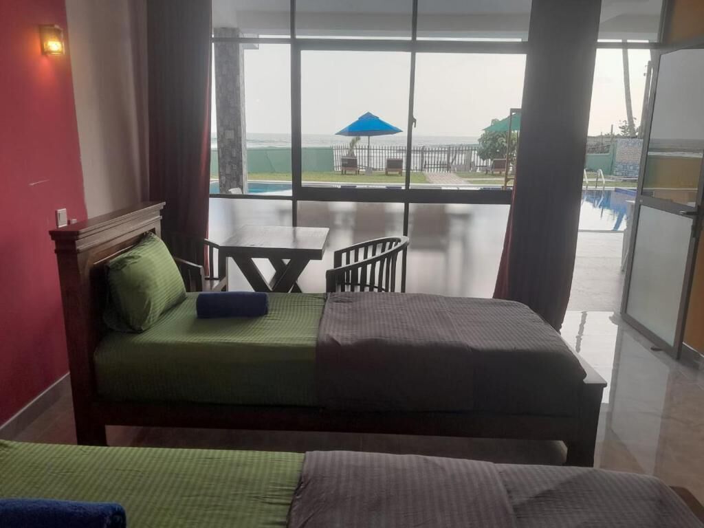 Deluxe Room, Multiple Bedrooms, Beach View, Beachfront | 2 bedrooms, minibar, in-room safe, desk