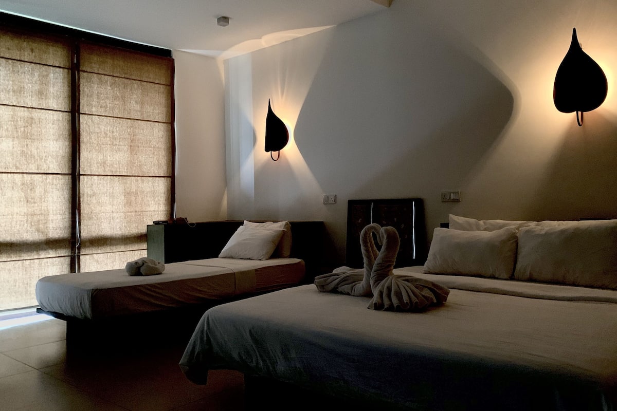 Deluxe Triple Room, 1 Bedroom, Garden View | 1 bedroom, minibar, in-room safe, individually decorated