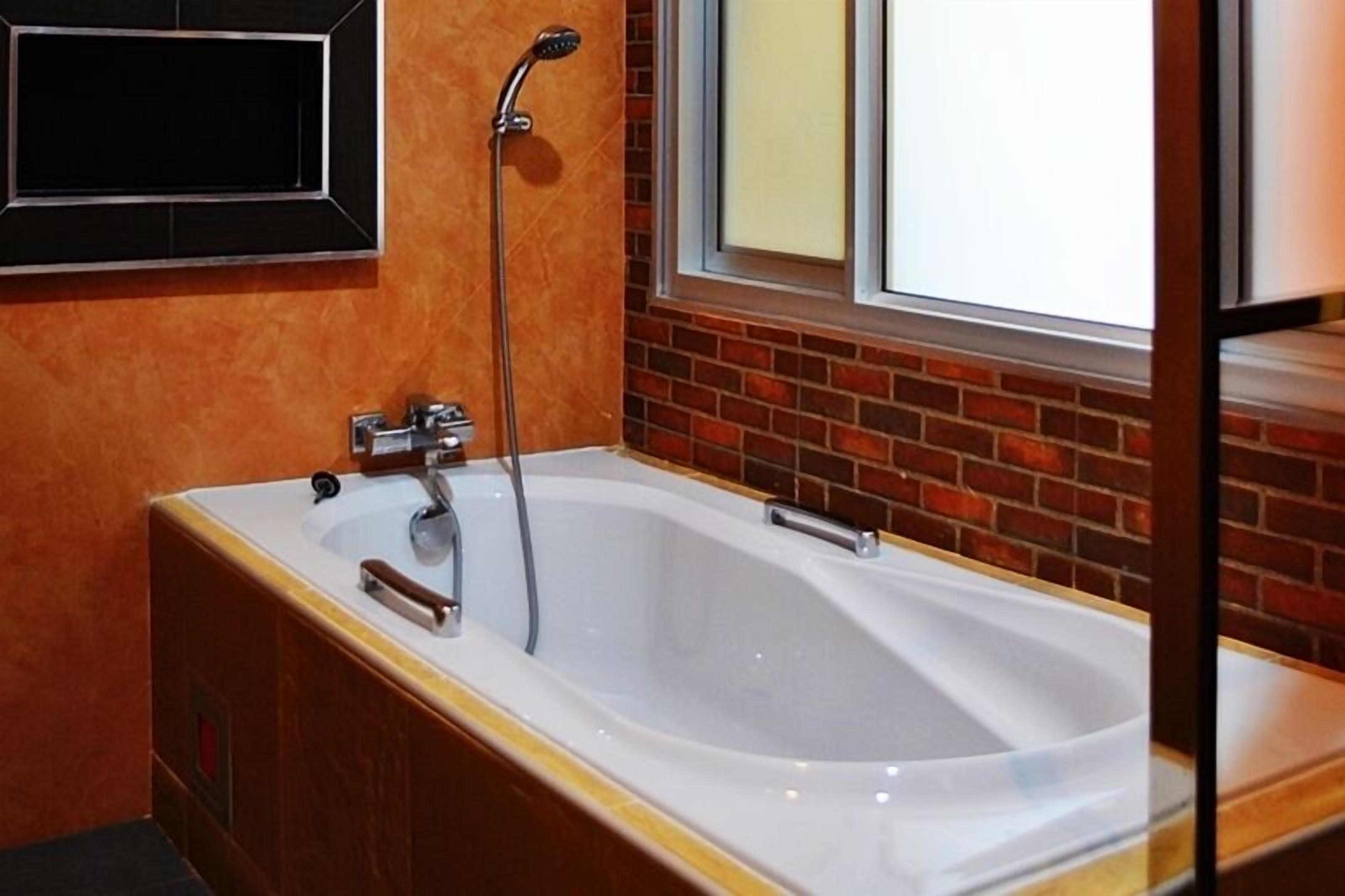 standard double room - building  | bathroom | shower, hair dryer, towels