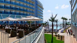 A cruise ship deck with outdoor seating and a pool area. - Vikingen Infinity Resort & Spa - All Inclusive (Alanya)