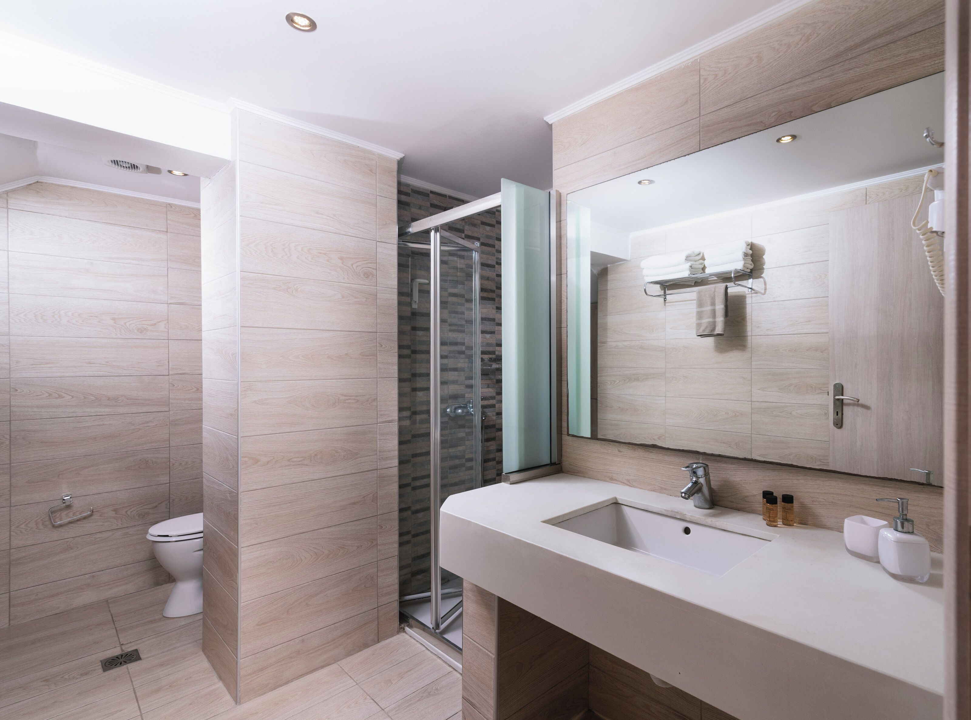 Bathtub, hair dryer, towels, soap