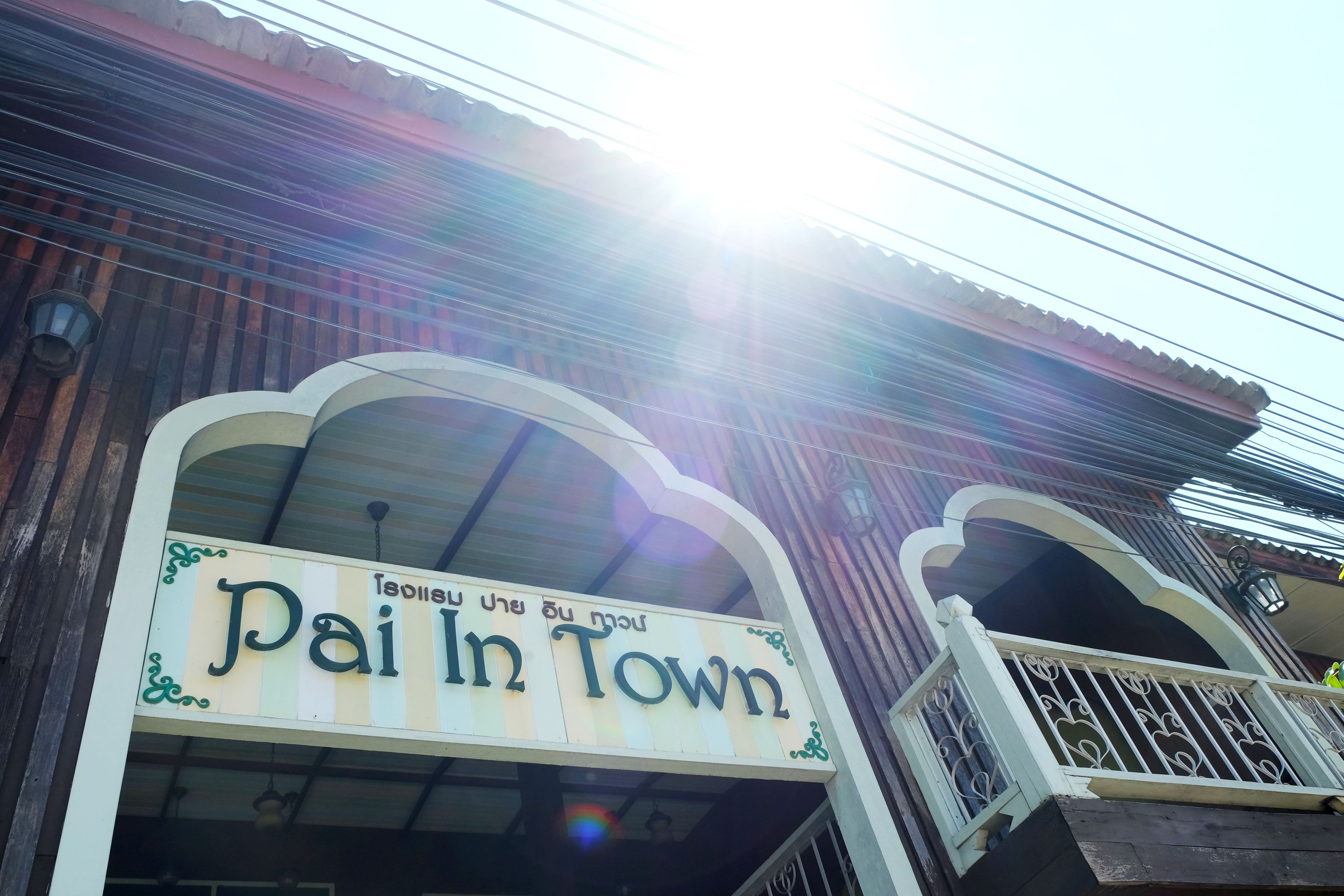A building with a sign that reads "Pai In Town".