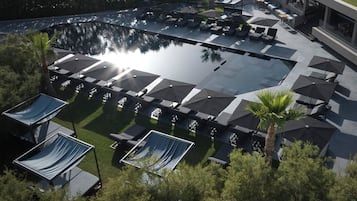 Outdoor pool, open 11:00 AM to 6:00 PM, free cabanas, pool umbrellas