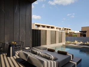 A modern outdoor seating area with a pool, featuring a sofa, chairs, and a table. - NEMA Design Hotel & Spa - Small Luxury Hotels of the World (Hersonissos)
