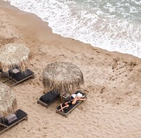 On the beach, sun-loungers, beach umbrellas