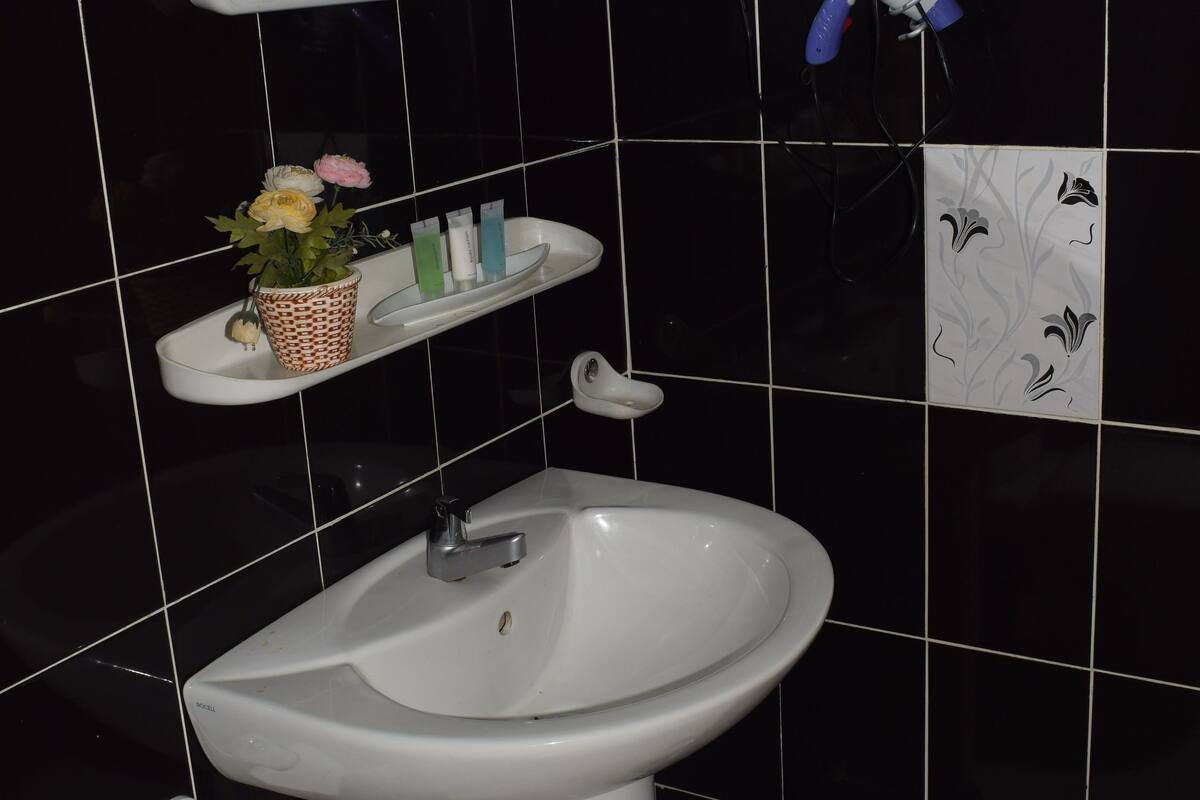 deluxe double room, 2 bedrooms, terrace, garden view | bathroom amenities | shower, free toiletries, bathrobes, towels